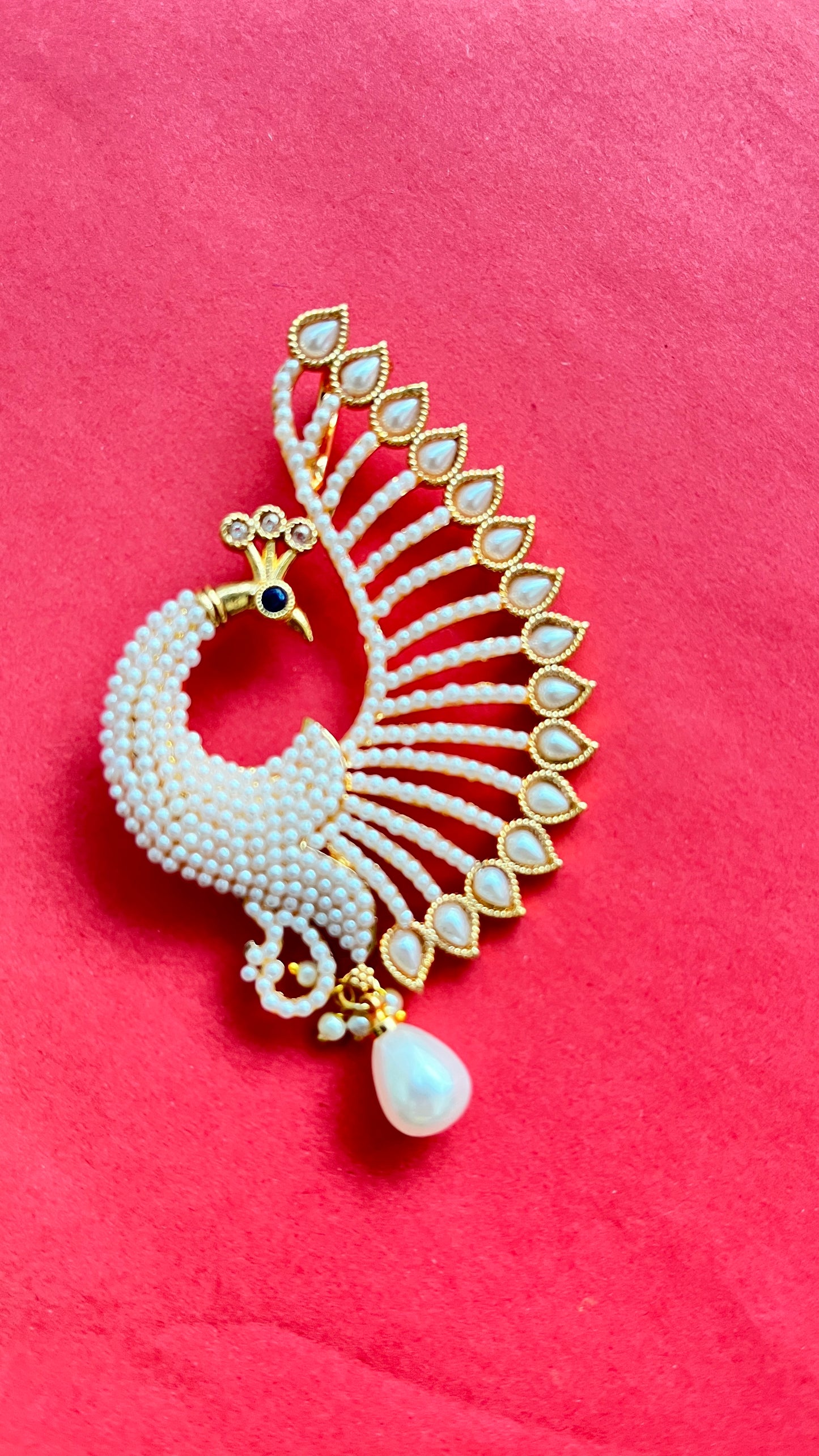 An elegant peacock pendant with matching earings with mala