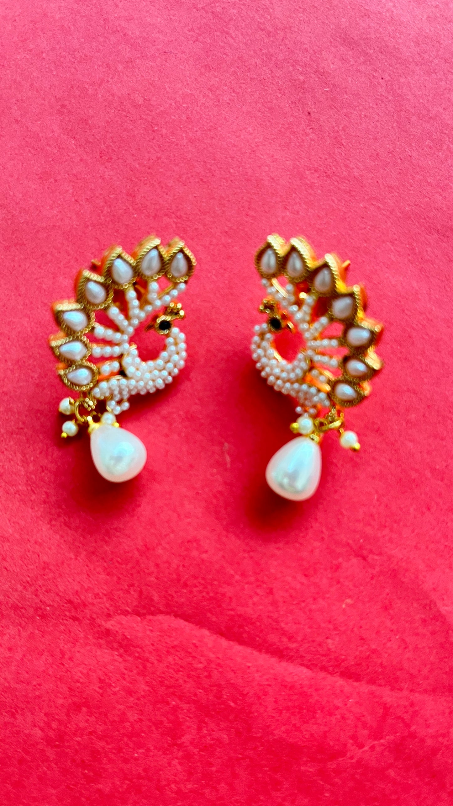 An elegant peacock pendant with matching earings with mala