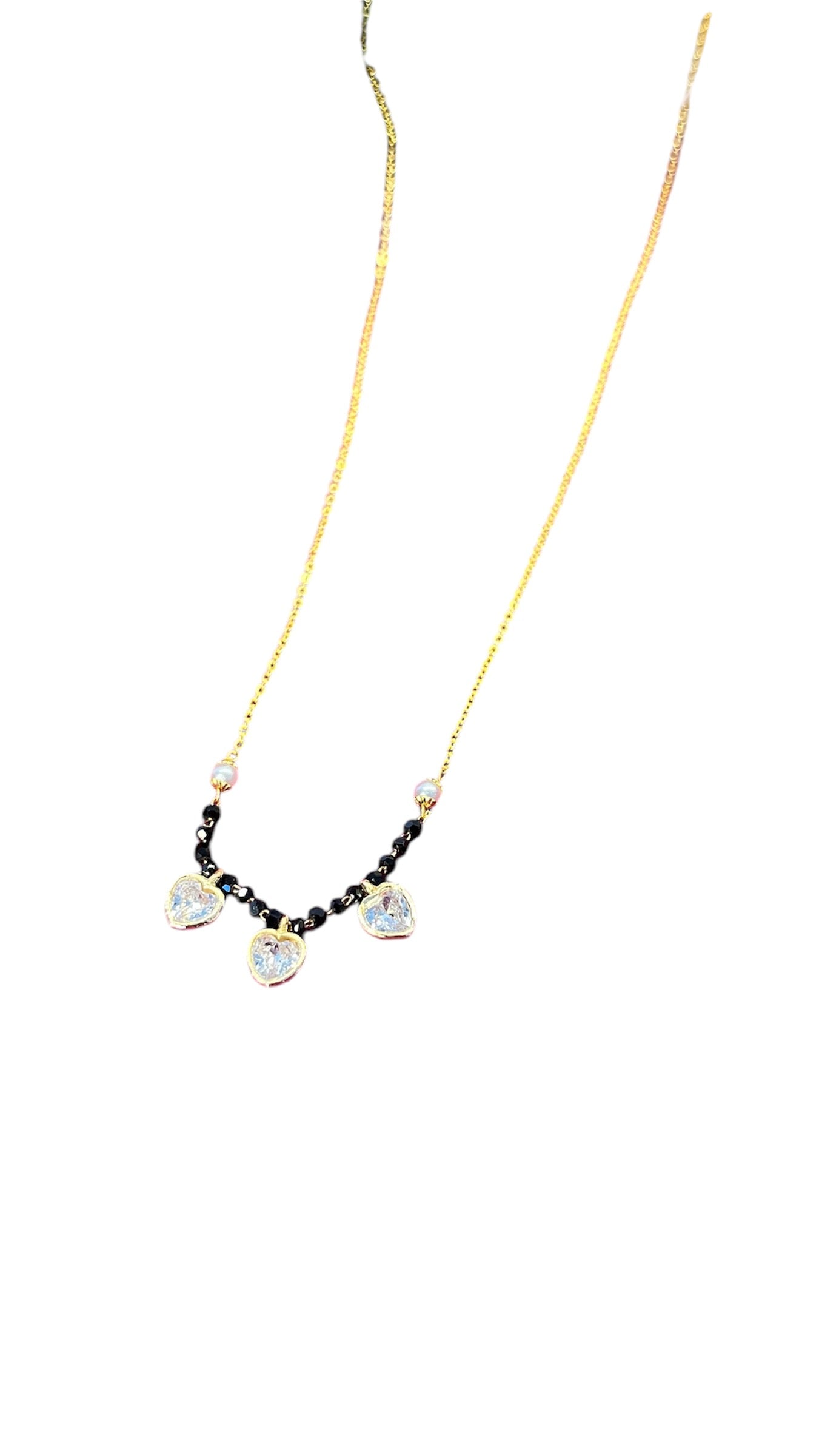 Menka Short Mangalsutra with three little hearts .
