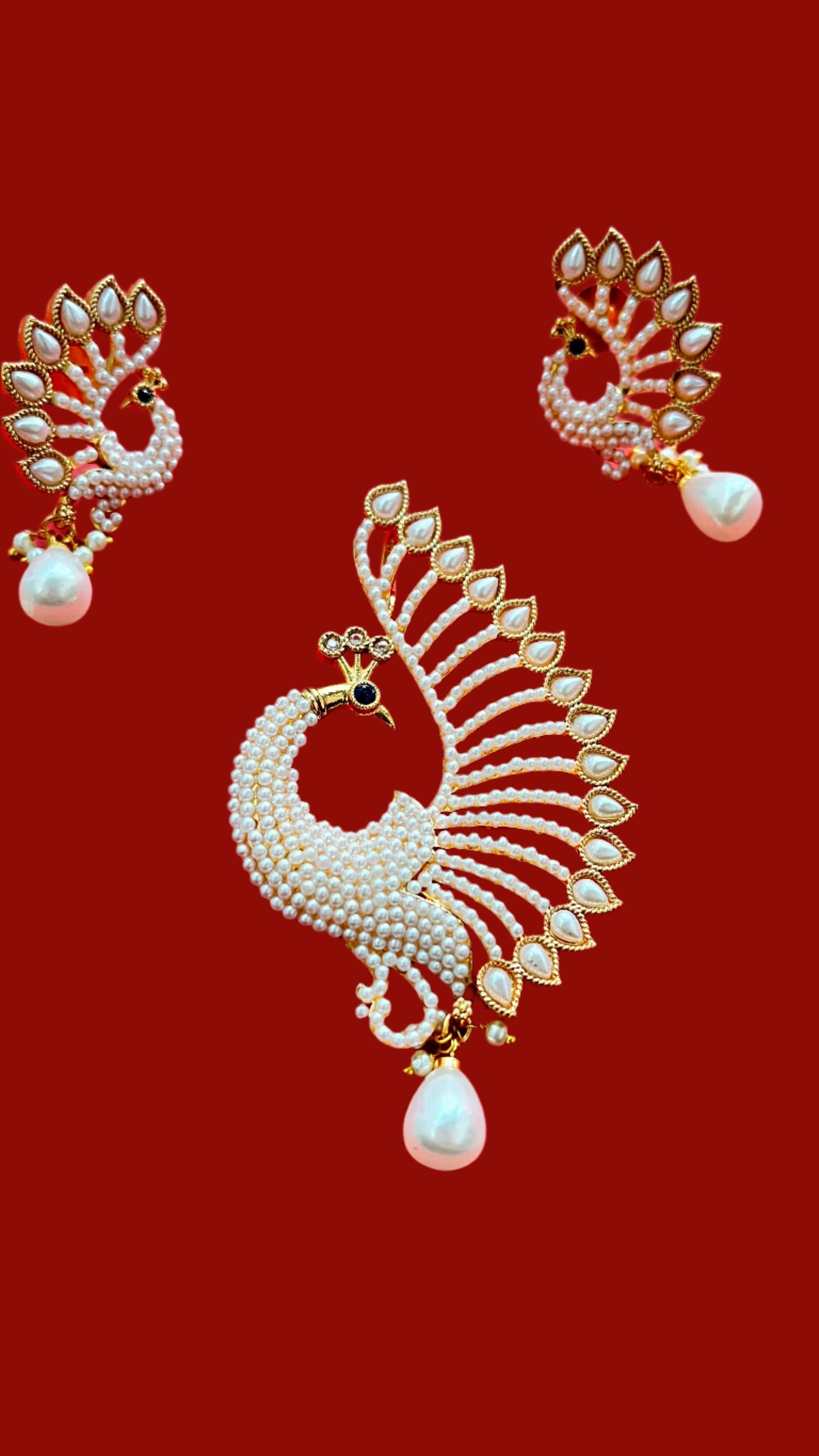 An elegant peacock pendant with matching earings with mala